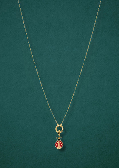 Golden Grace Lucky Ladybird Charm Necklace in full view, showcasing a 14K solid gold cable chain, golden charm holder, and lucky ladybird charm with red and black enamel by whywhy NYC.