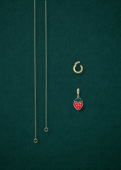 Separated components of the Golden Grace Sweet Strawberry Charm Necklace, including 14K solid gold cable chain, golden charm holder, and sweet strawberry charm with red enamel by whywhy NYC.