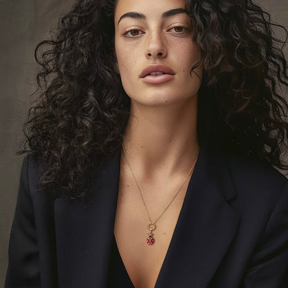 Model wearing the Golden Grace Lucky Ladybird Charm Necklace, featuring a 20-inch 1.5mm cable chain, an 11mm outer diameter, a 1.5mm thick 14K solid gold charm holder, and a red and black enamel ladybird charm crafted in 14K solid gold.