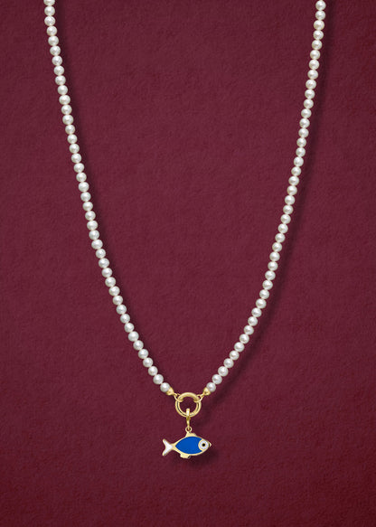 Lustrous Pearl Fishy Wishes Charm Necklace in full view, showcasing pearls, a golden link charm holder, and a fishy wishes charm in 14K solid gold by whywhy NYC.