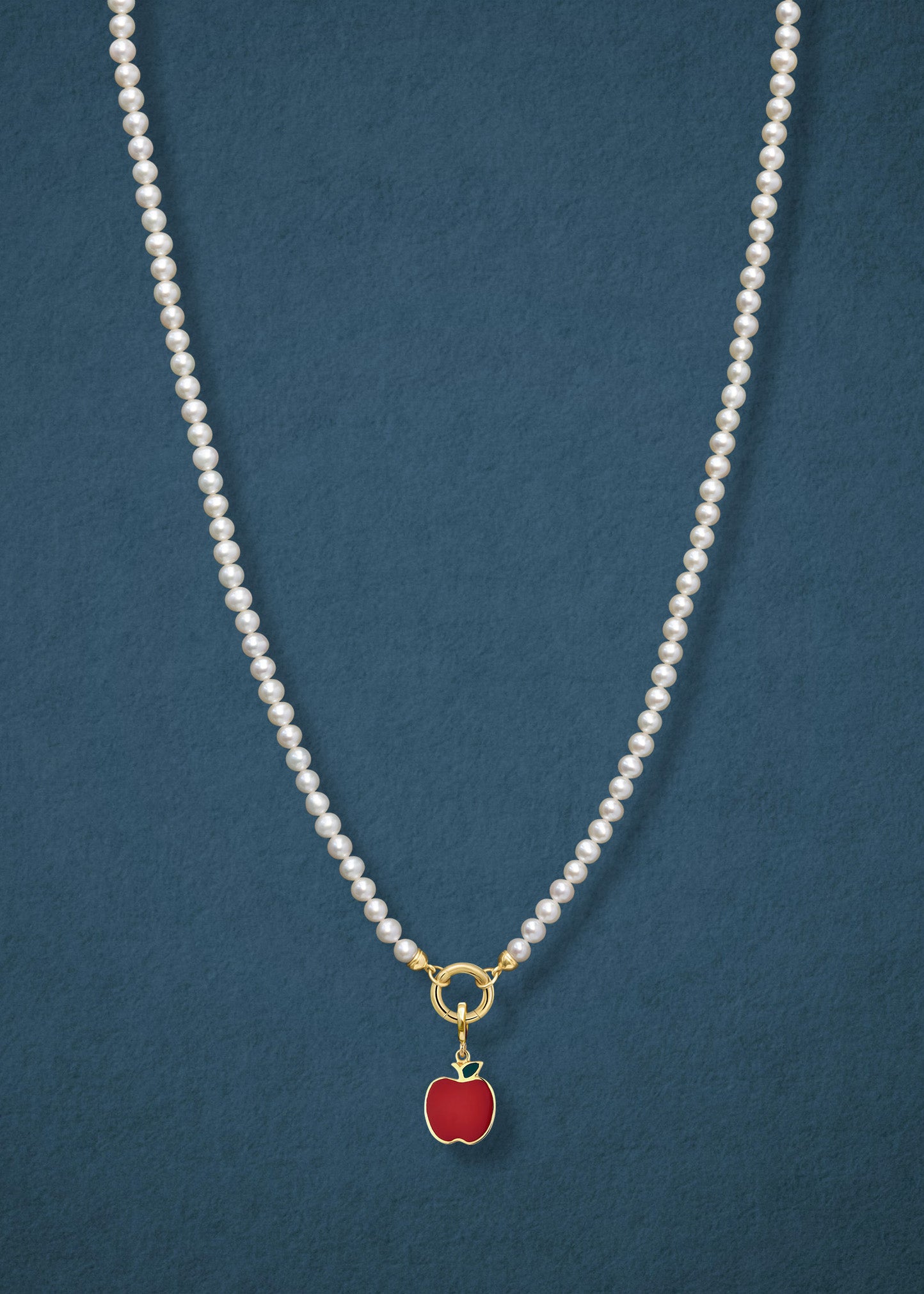 Lustrous Pearl Golden Apple of NYC Charm Necklace in full view, showcasing pearls, a golden link charm holder, and a golden apple charm in 14K solid gold by whywhy NYC.
