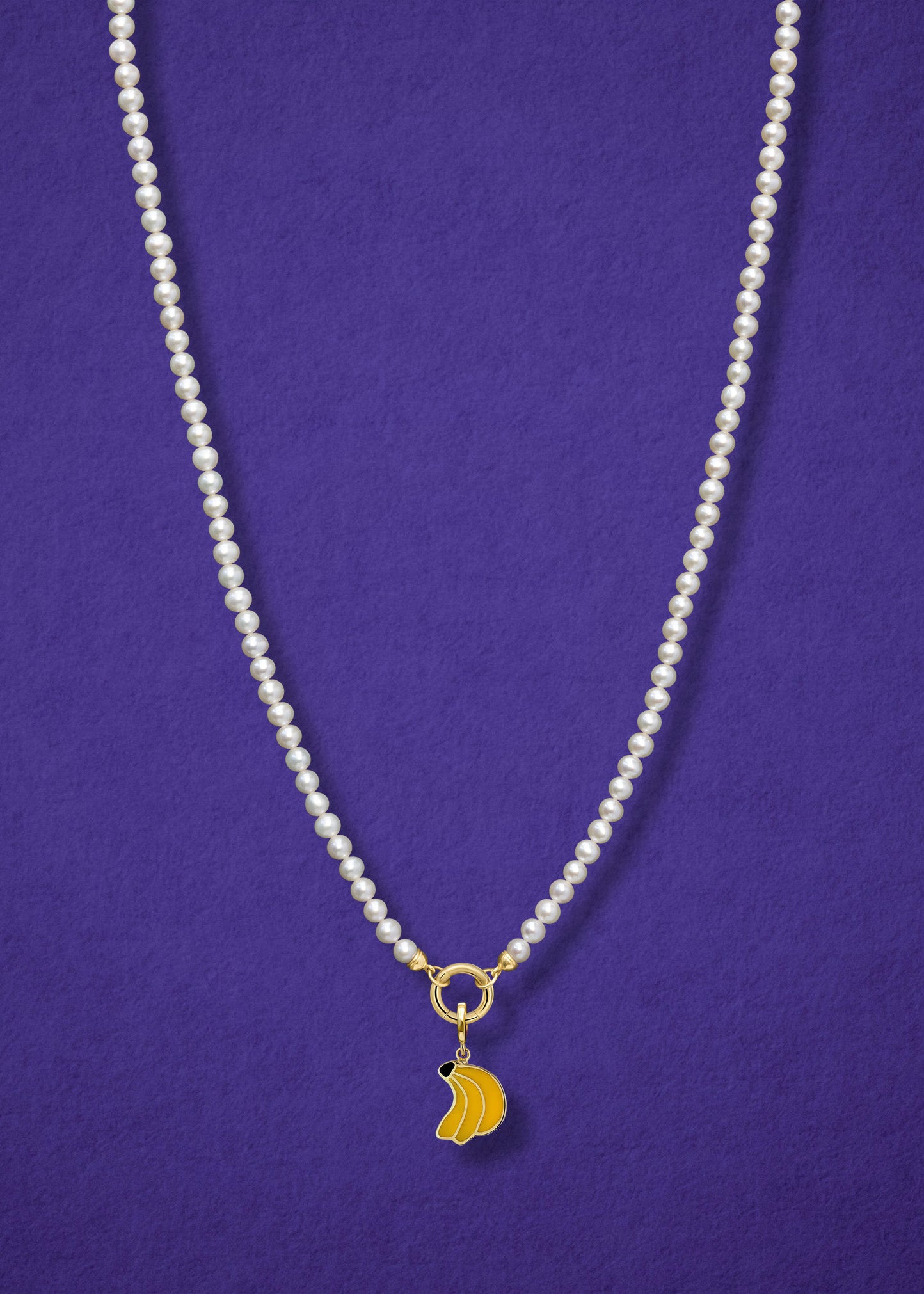 Lustrous Pearl Banana Bliss Charm Necklace in full view, showcasing pearls, a golden link charm holder, and a banana bliss charm in 14K solid gold by whywhy NYC.