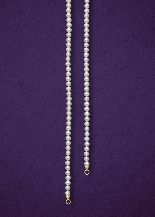 Lustrous Pearl Charm Necklace, a handcrafted 20-inch freshwater pearl necklace with a 14K solid gold clasp by whywhy NYC.