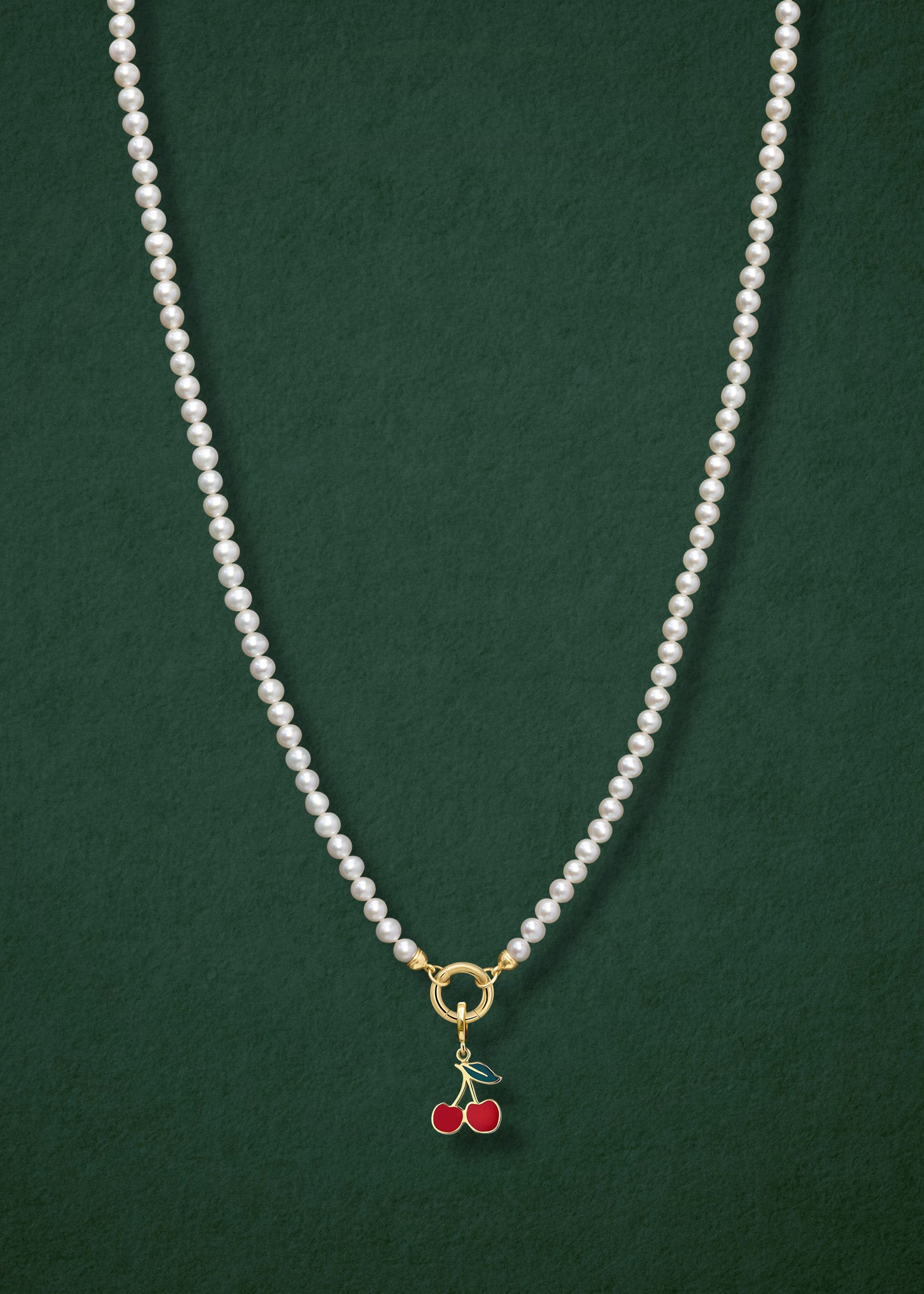 Lustrous Pearl Cherry on Top Charm Necklace in full view, showcasing pearls, a golden link charm holder, and a cherry on top charm in 14K solid gold by whywhy NYC.
