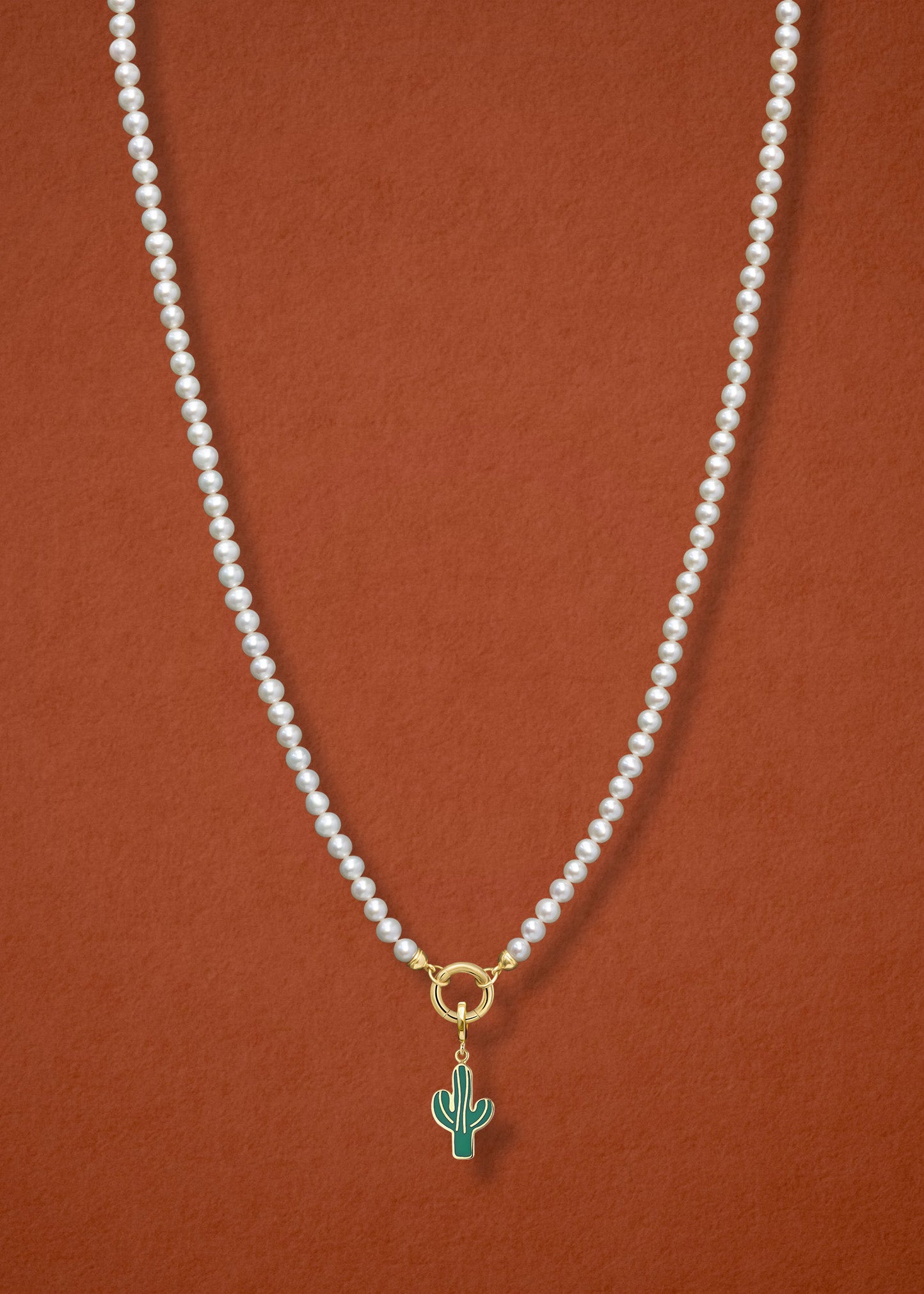 Lustrous Pearl Desert Bloom Charm Necklace in full view, showcasing pearls, a golden link charm holder, and a desert bloom charm in 14K solid gold by whywhy NYC.