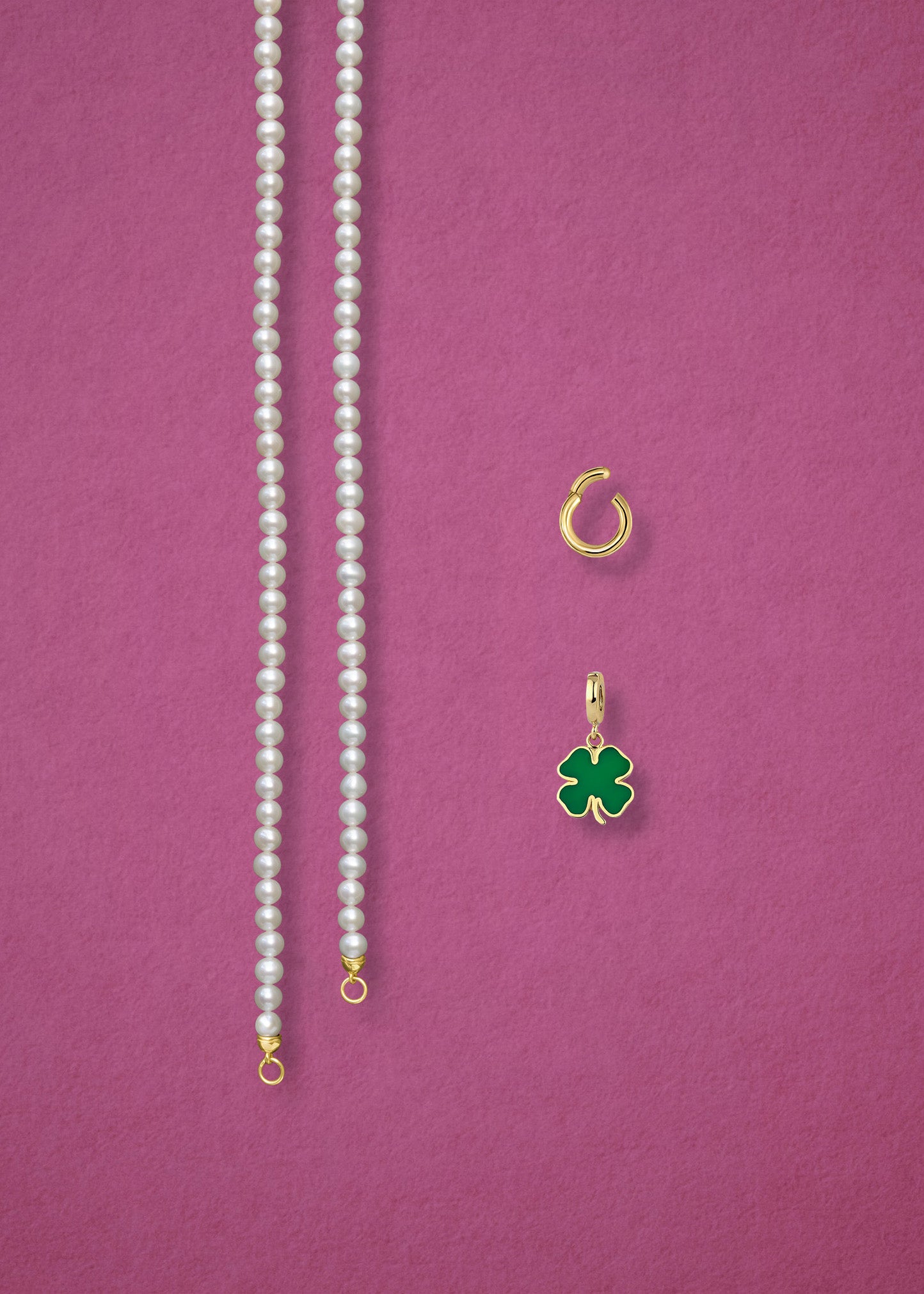 Separated components of the Lustrous Pearl Lucky Clover Charm Necklace, including pearl necklace, charm holder, and lucky clover charm in 14K solid gold by whywhy NYC.