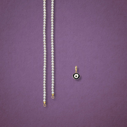 Obsidian Organic Evil Eye Charm, Golden Link Charm Holder, and the Lustrous Pearl necklace displayed separately on a pink background to show styling options.