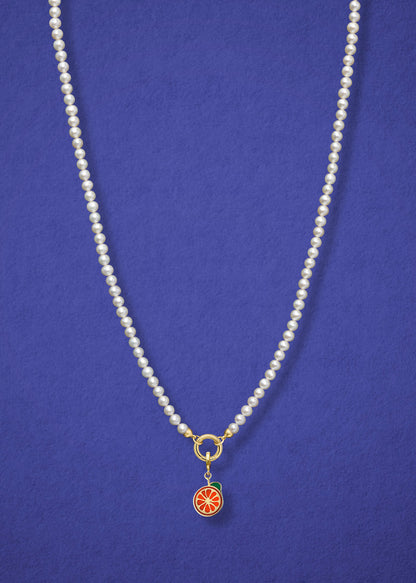 Lustrous Pearl Orange Crush Charm Necklace in full view, showcasing pearls, a golden link charm holder, and an orange crush charm in 14K solid gold by whywhy NYC.