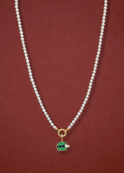 Lustrous Pearl Turtle Treasure Charm Necklace in full view, showcasing pearls, a golden link charm holder, and a turtle treasure charm in 14K solid gold by whywhy NYC.
