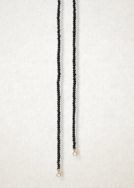 Noir Elegance Charm Necklace, a 20-inch handcrafted black spinel necklace with a 14K solid gold clasp by whywhy NYC.
