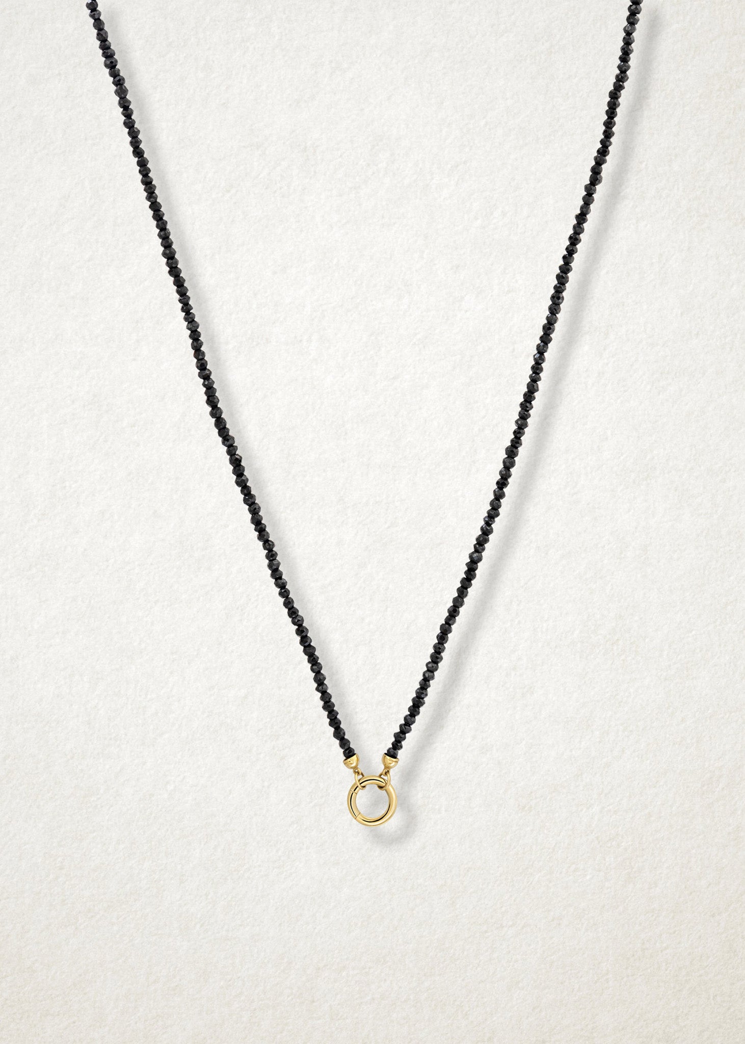 Noir Elegance Charm Necklace paired with a 14K solid gold charm holder by whywhy NYC, perfect for bold and refined charm designs.