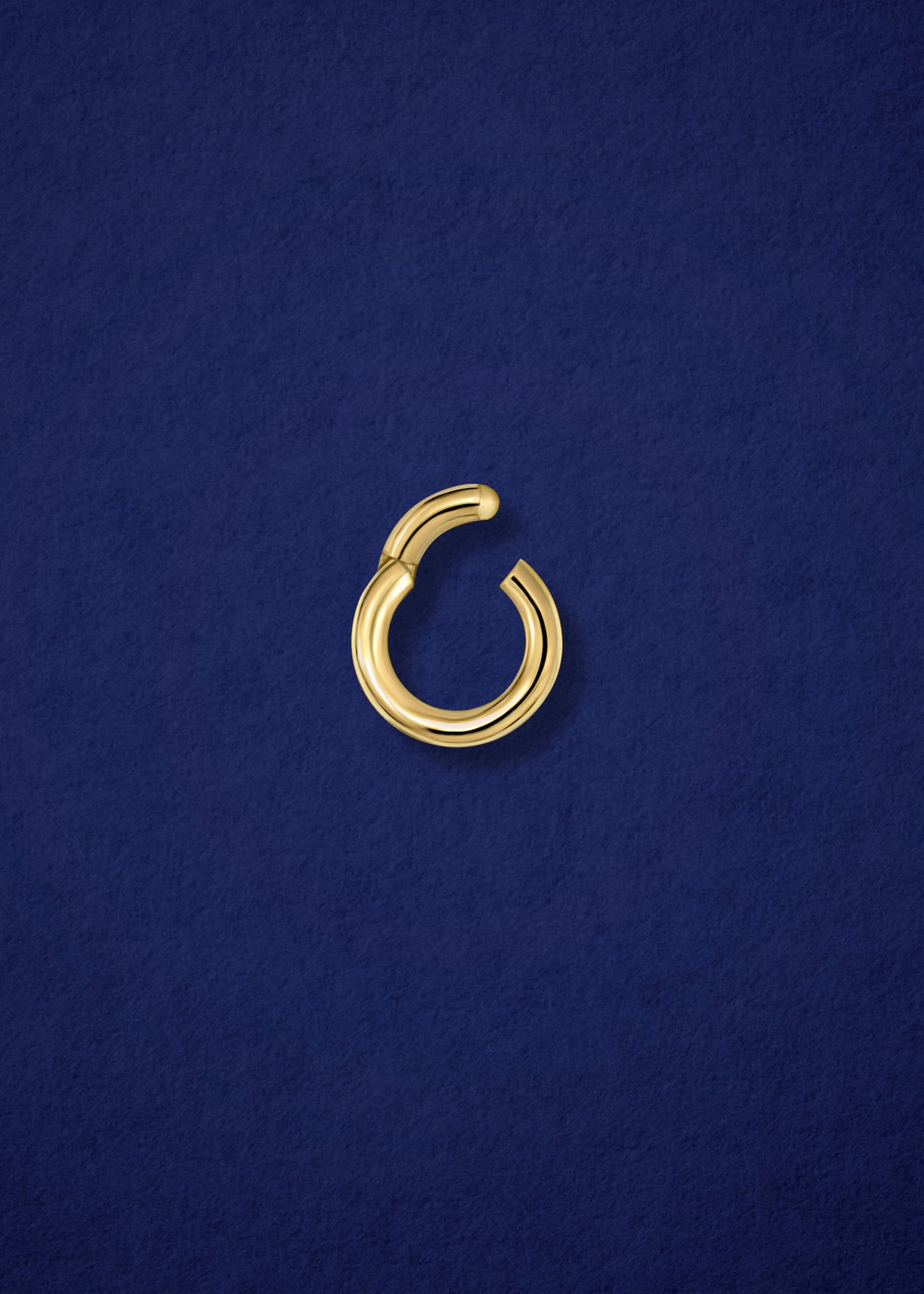 Open 14K solid gold charm holder by whywhy NYC, showcasing its sleek design and secure functionality.