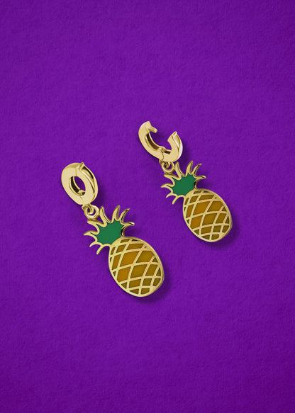Pineapple Paradise Charm showing both open and closed views of the 14K solid gold clip, with yellow and green enamel detailing, displayed on a purple background.