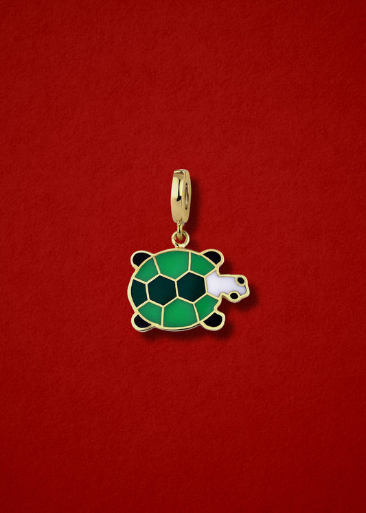 Measurement view of Turtle Treasure Charm by whywhy NYC, 14K solid gold with green enamel, approximately 20mm in length.